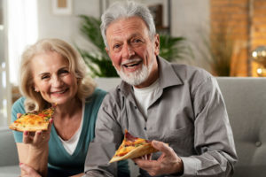 dental implant patients smiling and eating