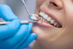 An image of a woman getting treated for gum disease